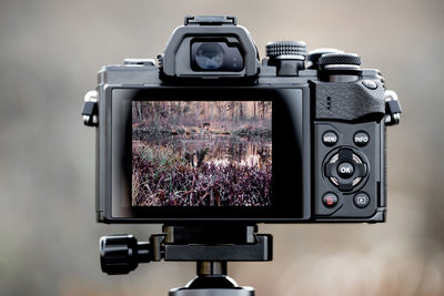 Close-up of dslr camera on tripod