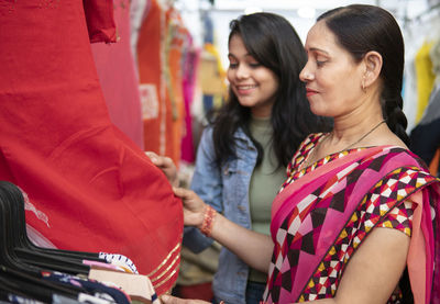 Women standing on a smiling