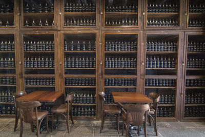 Chairs and tables in bottles