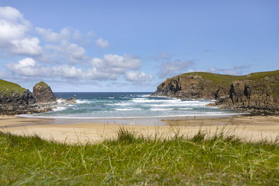 Scenic view of beach against sky