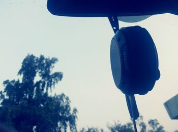 Low angle view of hanging tree against sky