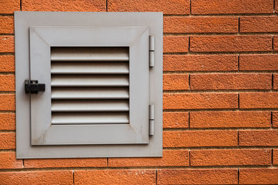 Close-up of window on brick wall