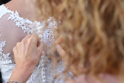 Close-up of woman holding hands