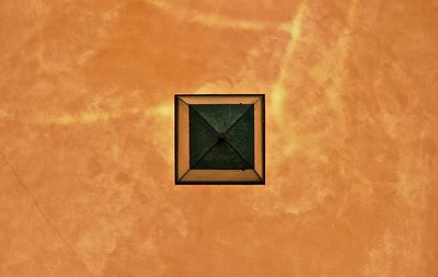 Low angle view of window on wall