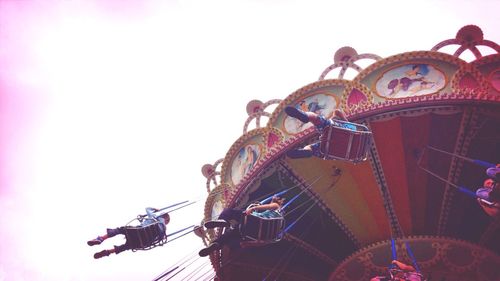 Low angle view of ferris wheel against sky