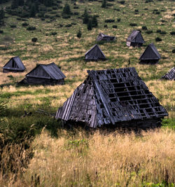 Lounge chairs on field against buildings