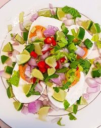 High angle view of chopped fruits in plate