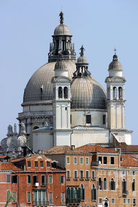 Church in city against clear sky