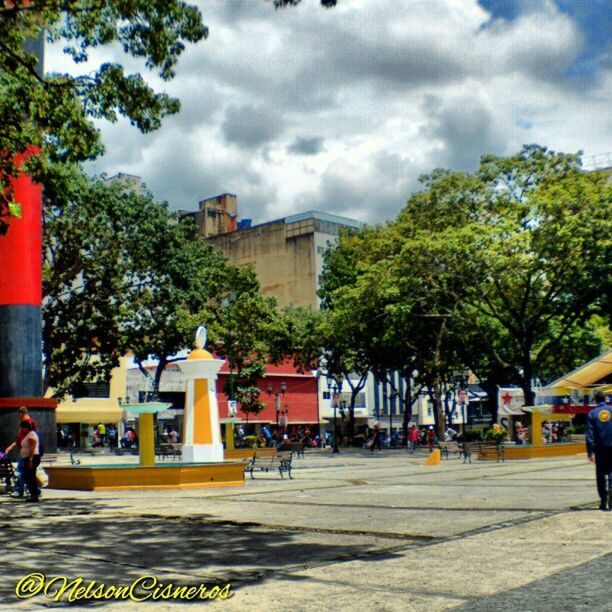 building exterior, architecture, tree, built structure, sky, cloud - sky, men, person, cloud, lifestyles, city, leisure activity, street, incidental people, large group of people, cloudy, medium group of people, walking, city life