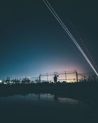 Low angle view of illuminated people at night