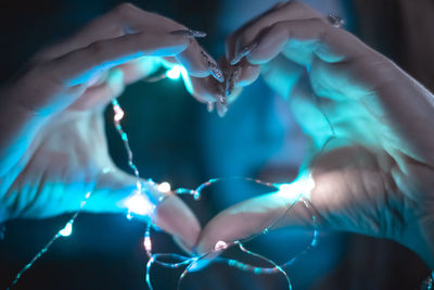 Close-up of woman hands in water