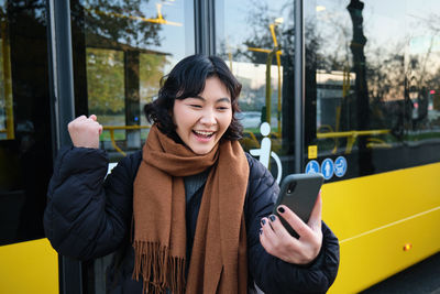 Portrait of young woman in train