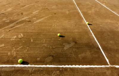 High angle view of balls on tennis court