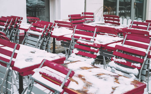 Close-up of chairs on table