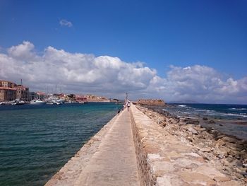 Scenic view of sea against blue sky