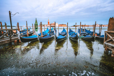 Boats moored in canal