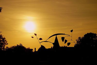 Silhouette hot air balloon against sky during sunset