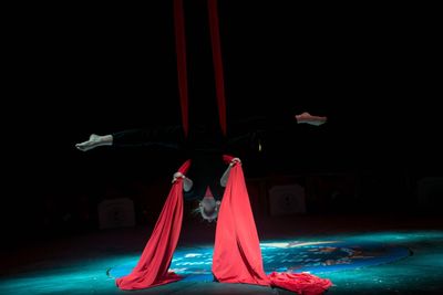 Person dancing in illuminated stage at night