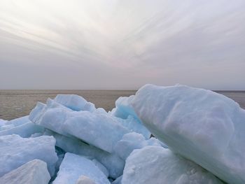 Stunning view of ice floes on the seaside during sunset
