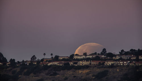 Scenic view of mountains against clear sky at sunset