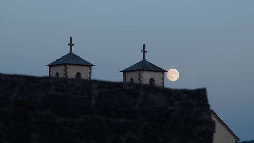 Low angle view of church against clear sky at dusk