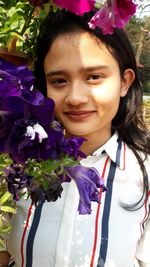 Portrait of young woman with bouquet