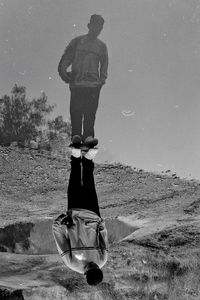 Rear view of man standing on beach