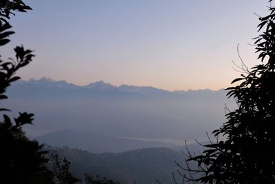 Scenic view of silhouette mountains against sky at sunset