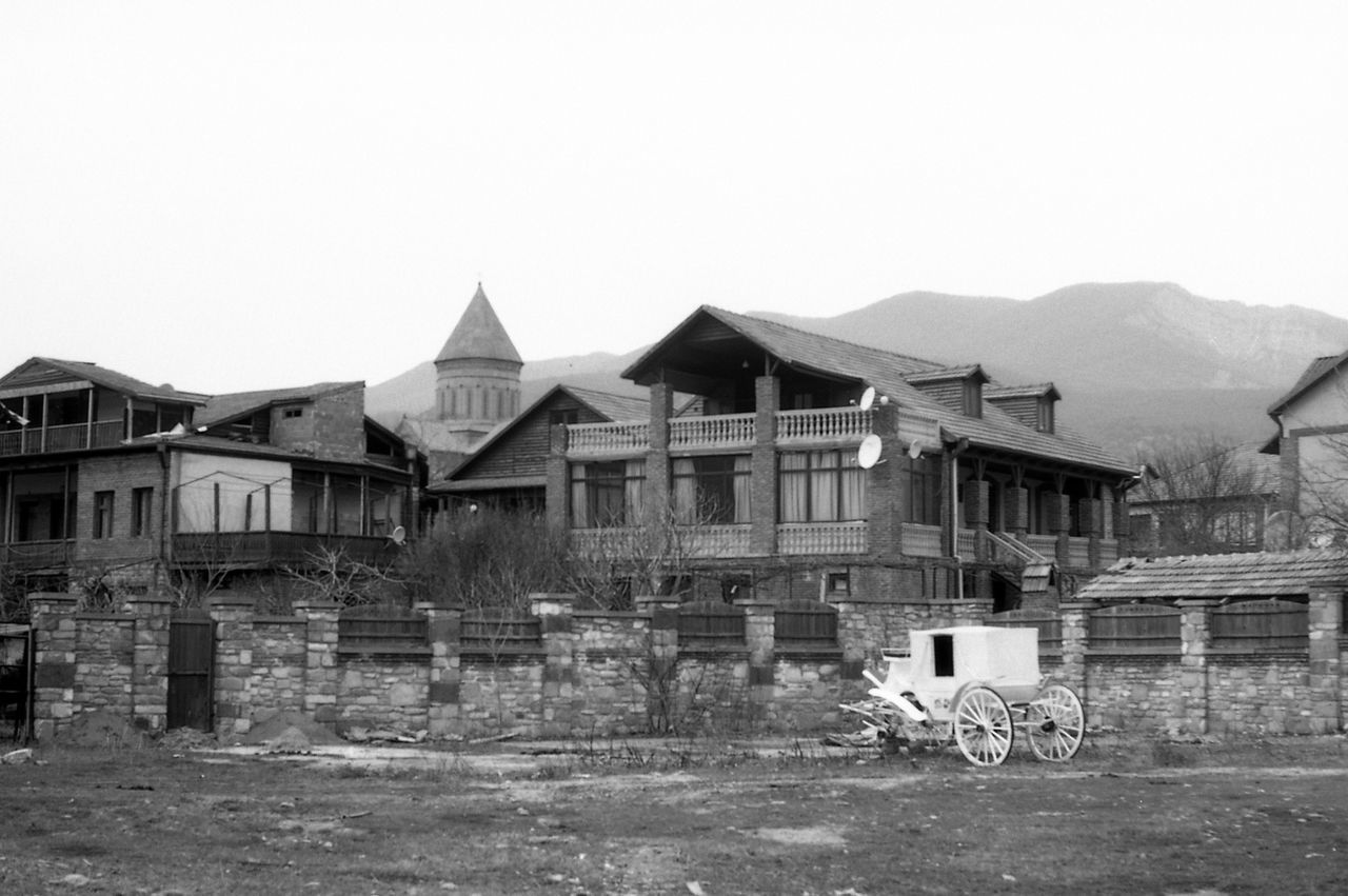 HOUSES AGAINST SKY