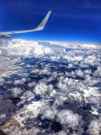 Low angle view of mountain range against cloudy sky