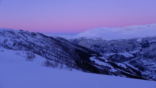 Scenic view of snow covered mountains