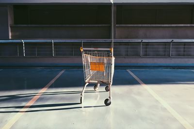 Close-up of shopping cart in court