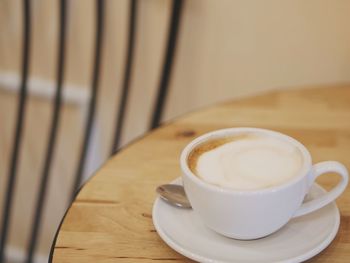 Close-up of cappuccino on table