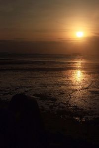 Scenic view of sea at sunset