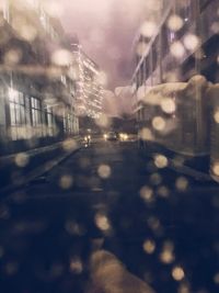 Cars on road in city at night