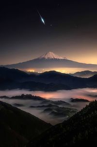 Scenic view of mountains against sky during sunset