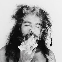 Portrait of man smoking cigarette