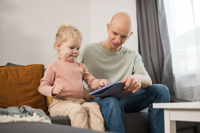 Boy using laptop at home