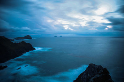 Scenic view of sea against cloudy sky