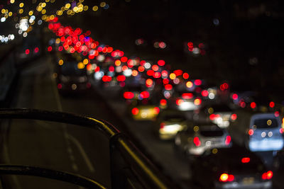 Defocused image of illuminated city at night