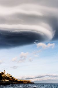 Scenic view of sea against cloudy sky