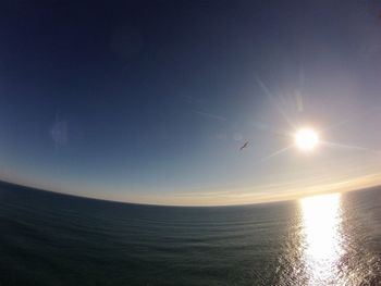 Scenic view of sea against clear sky during sunset