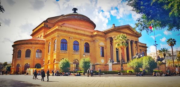 Group of people in front of historical building