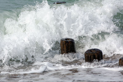 Waves splashing on groyne