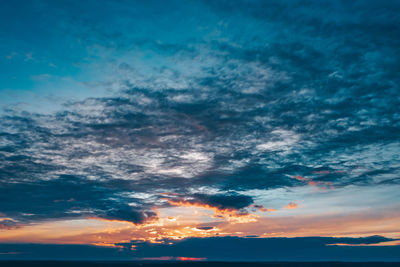 Low angle view of dramatic sky during sunset