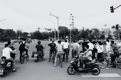 People riding motorcycle on road