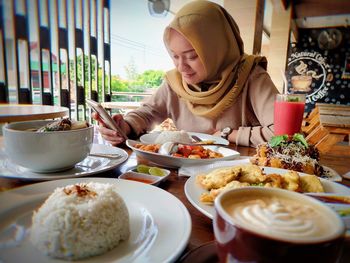 Midsection of woman having food