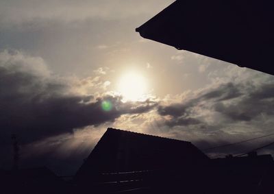 Low angle view of silhouette building against sky during sunset