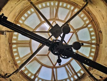 Low angle view of clock on ceiling