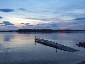 Scenic view of lake at sunset